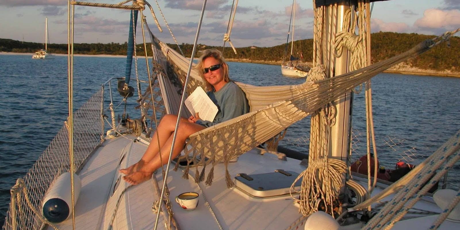 Family sailing at sunset